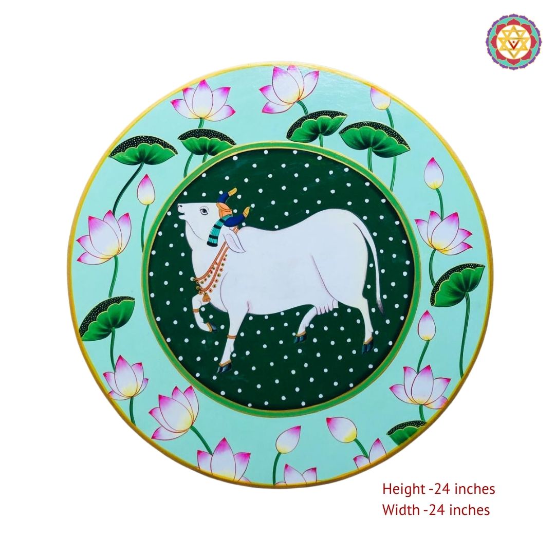 Close view of cow with lotus pichwai wall plate showing artistic brushwork