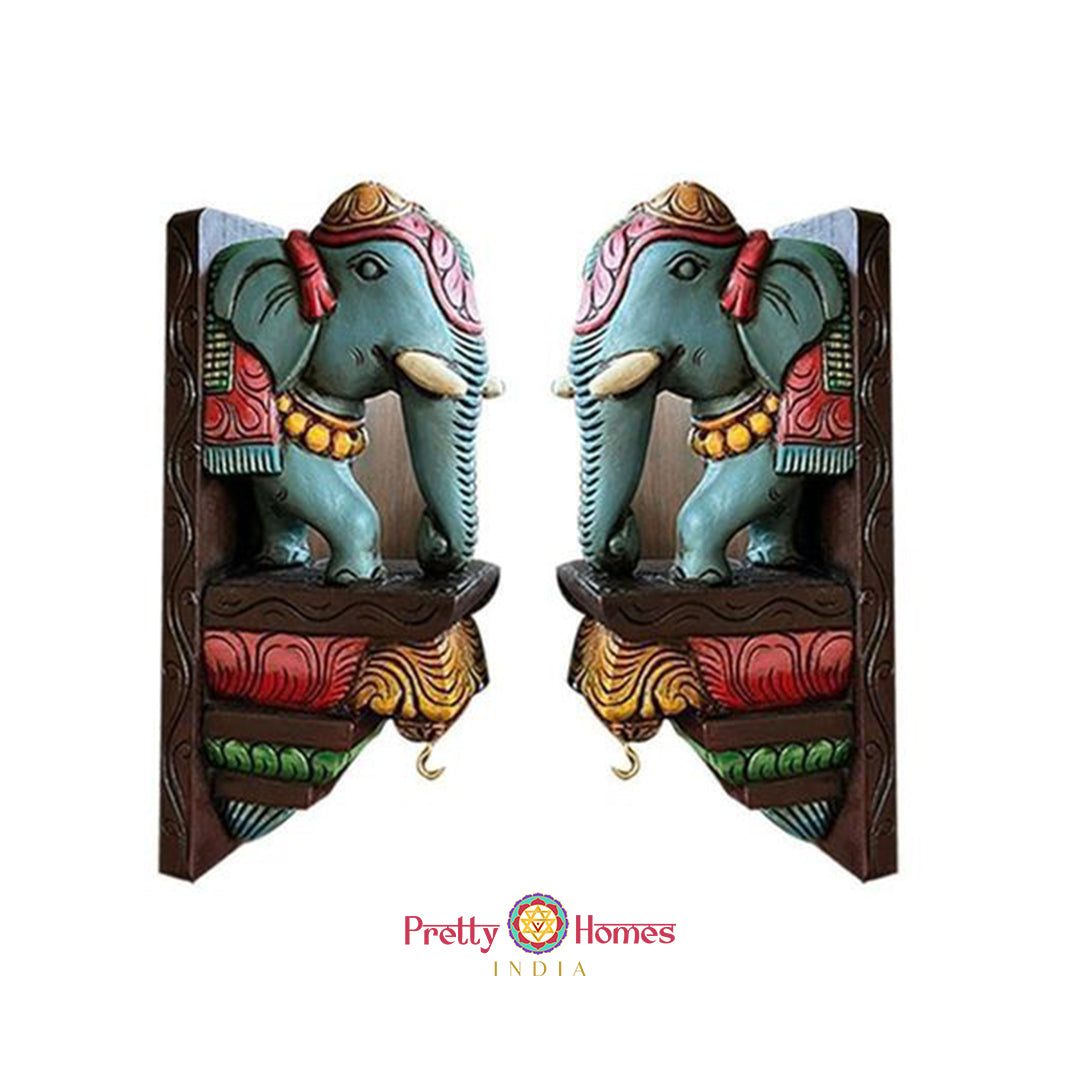 Pair of hand-painted wooden elephant corbels in multicolour antique finish for wall decor.