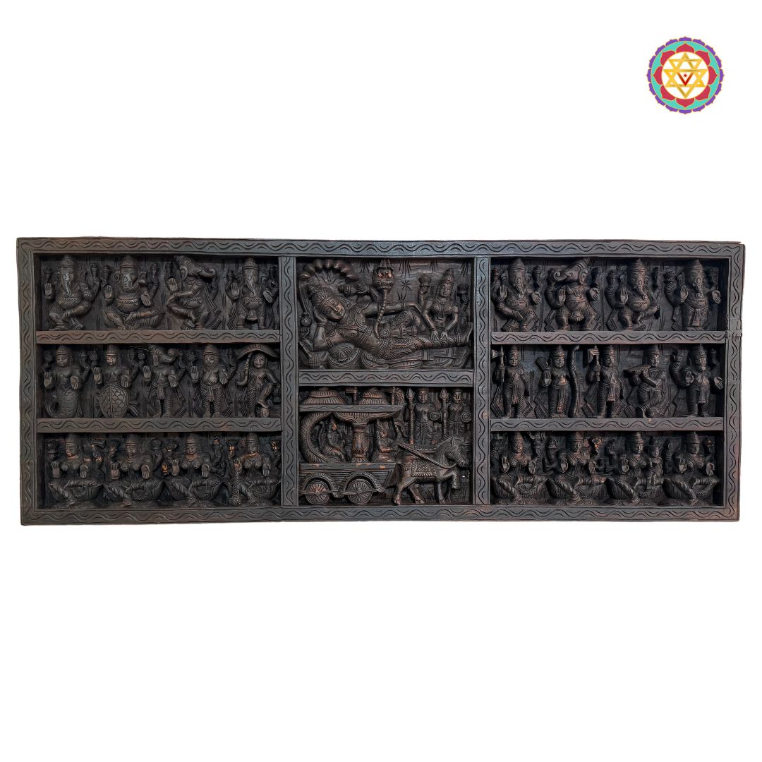 Intricately carved wooden panel depicting Krishna guiding Arjun on a chariot full view