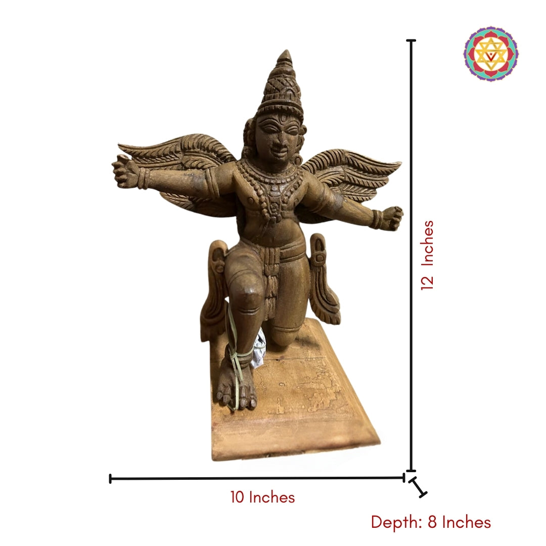 side profile of garuda wood carving showing detailed wings