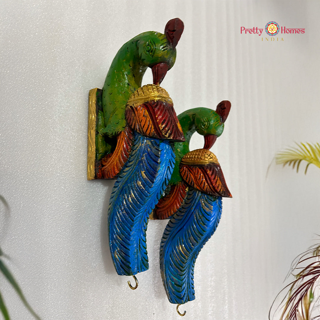 hand-carved parrot wall brackets in blue and green