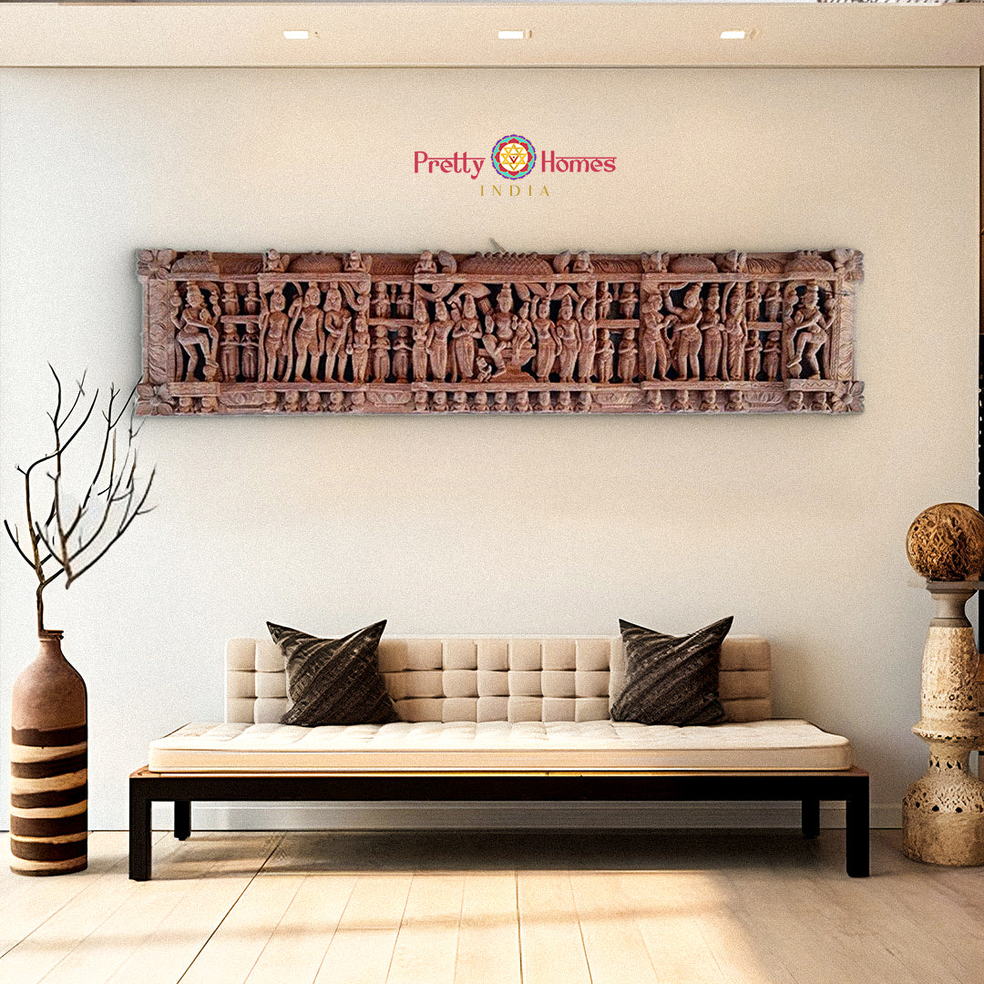 Wooden wall panel showing Shiva and Parvati surrounded by gods – antique temple carving decor.