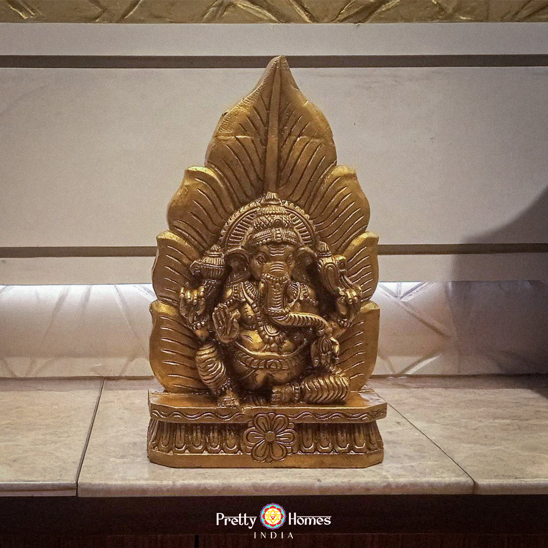 wood carved ganesha in leaf motif with natural wood polish and minimalist design