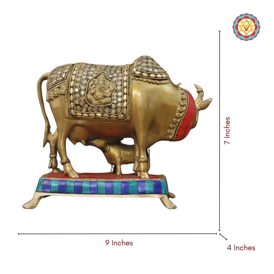 Kamdhenu brass statue on decorative base with traditional motifs