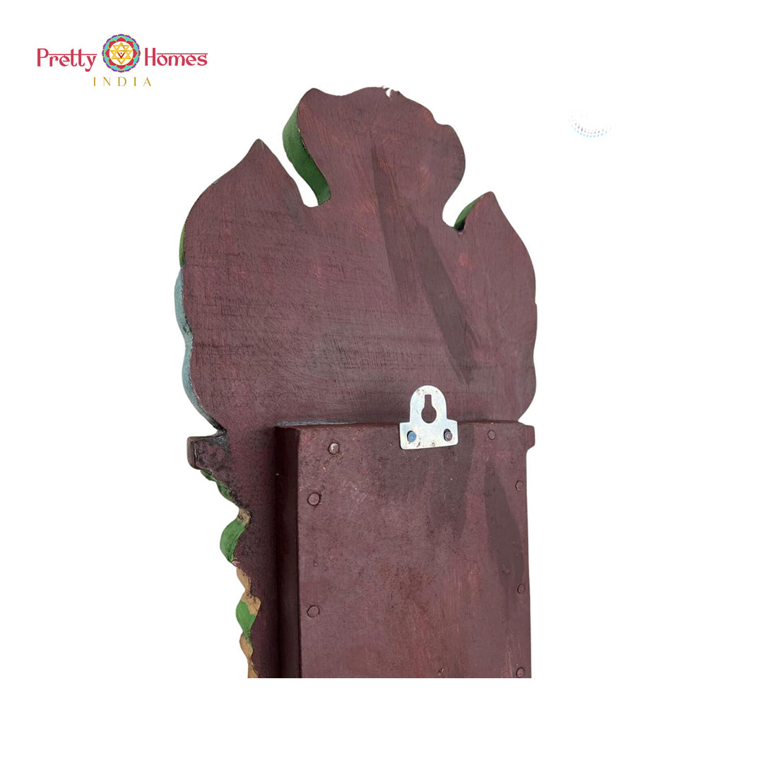 Detailed Ganesha carving — artisan-crafted wooden wall hanging.