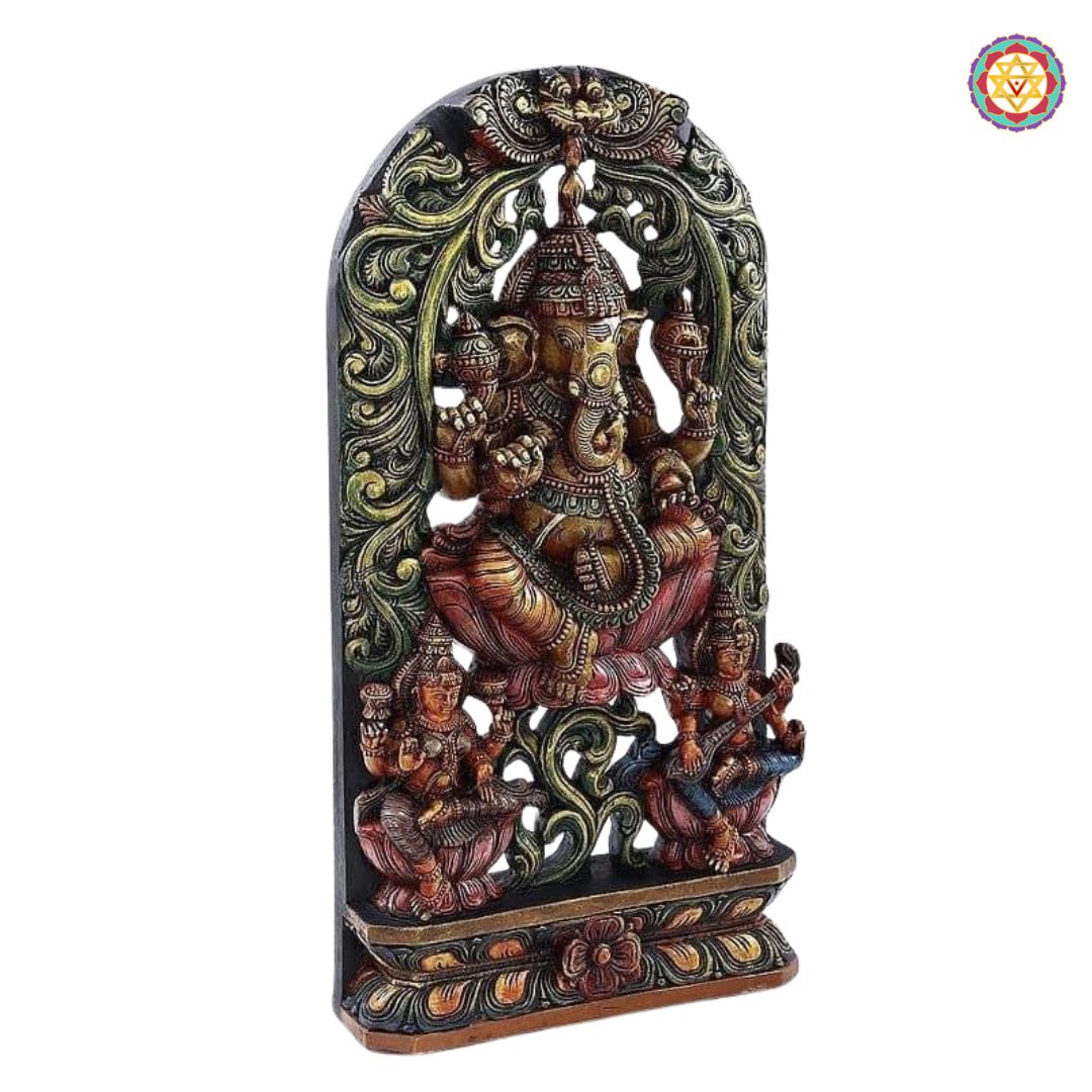 Detailed carving of deities on wood panel — traditional temple art with polished antique surface