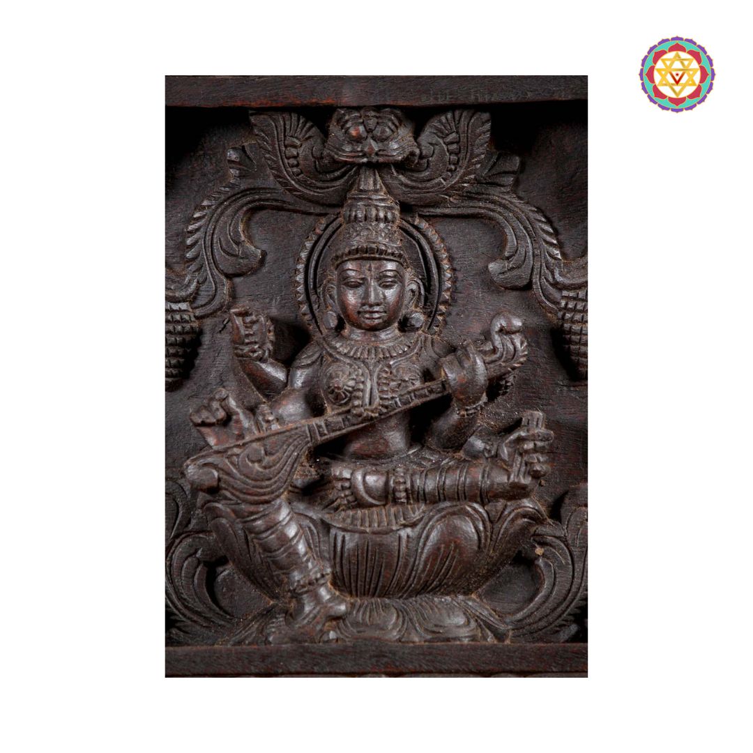 Saraswati motif with veena on carved wooden panel