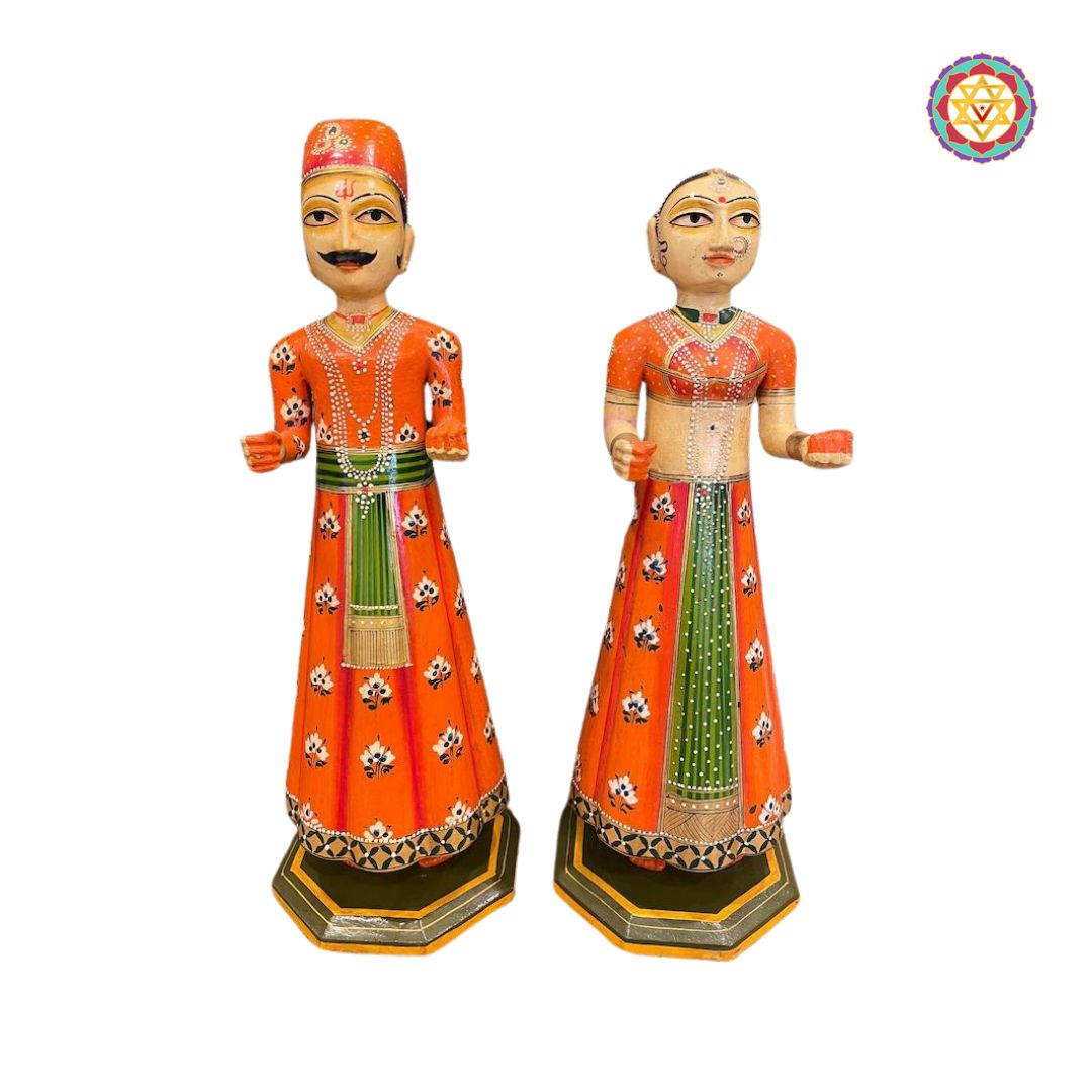 close up of rajasthani decorative wooden dolls with vibrant paintwork