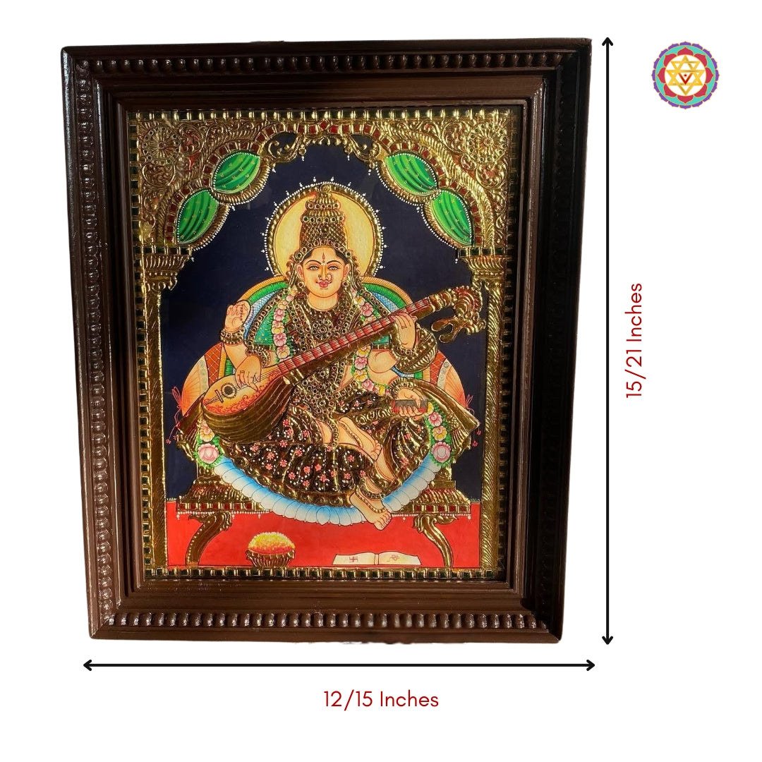 “Traditional Saraswati Tanjore painting framed in rich wooden finish with divine symbolism”