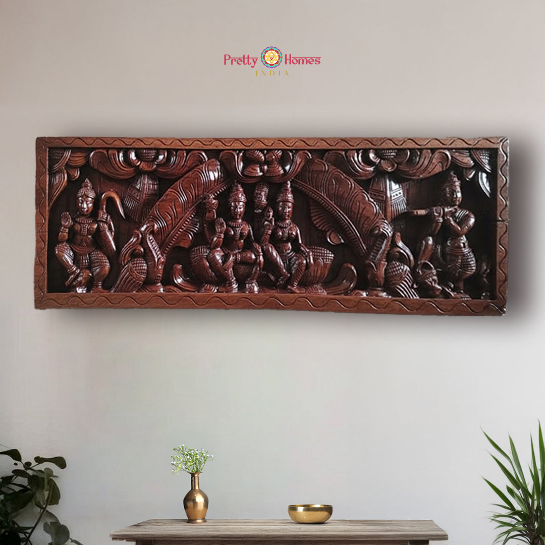Horizontal wood carved panel of Vishnu Lakshmi with Hanuman and Krishna in center