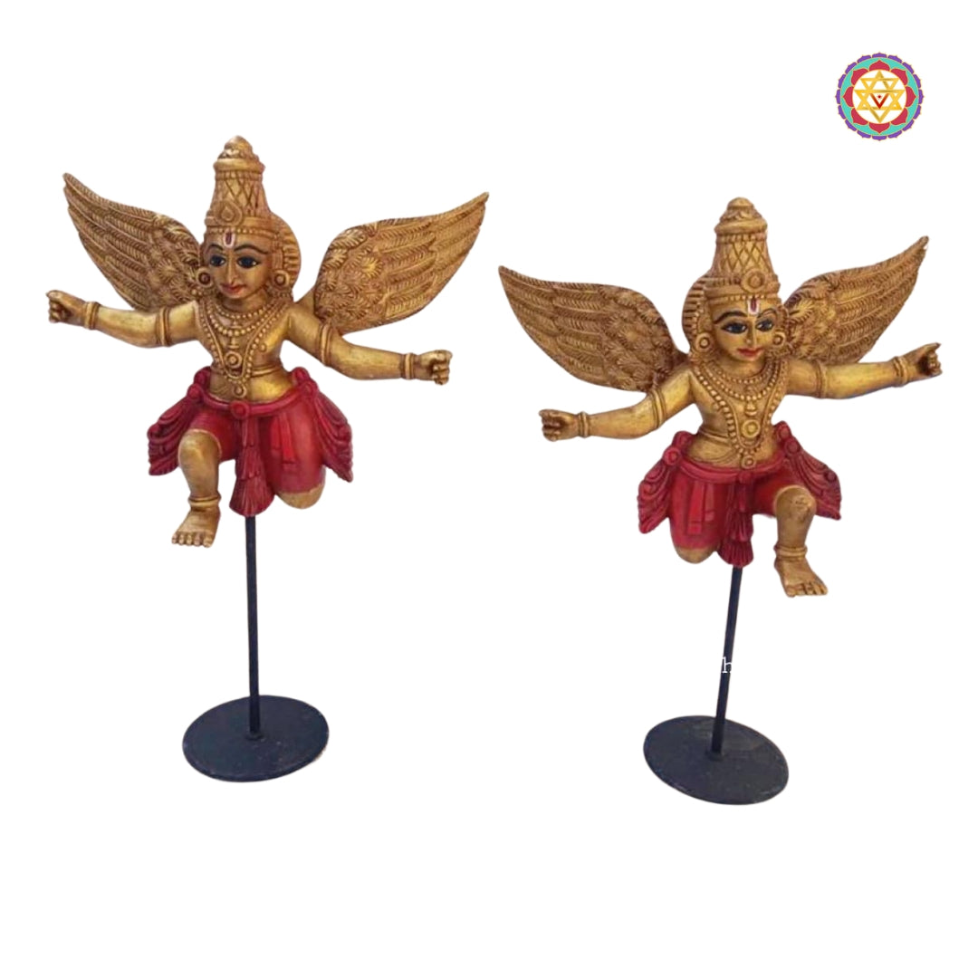 Close-up of Gandharva tabletop wooden sculpture showing hand-painted gold and brown detailing — artisan home decor piece