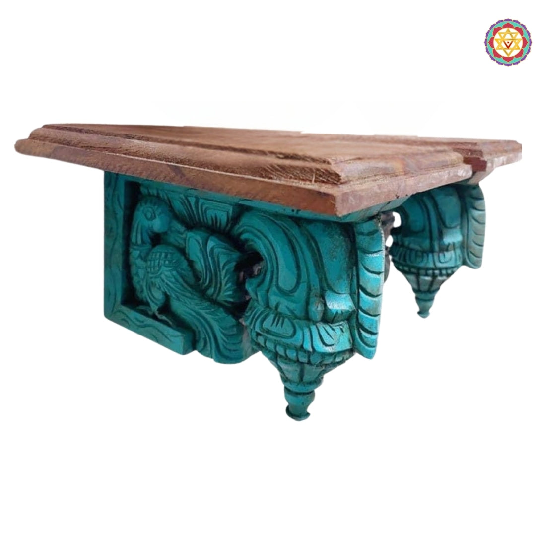 Detailed close-up of wooden bodhil bracket with peacock design and fine South Indian handcarved artistry