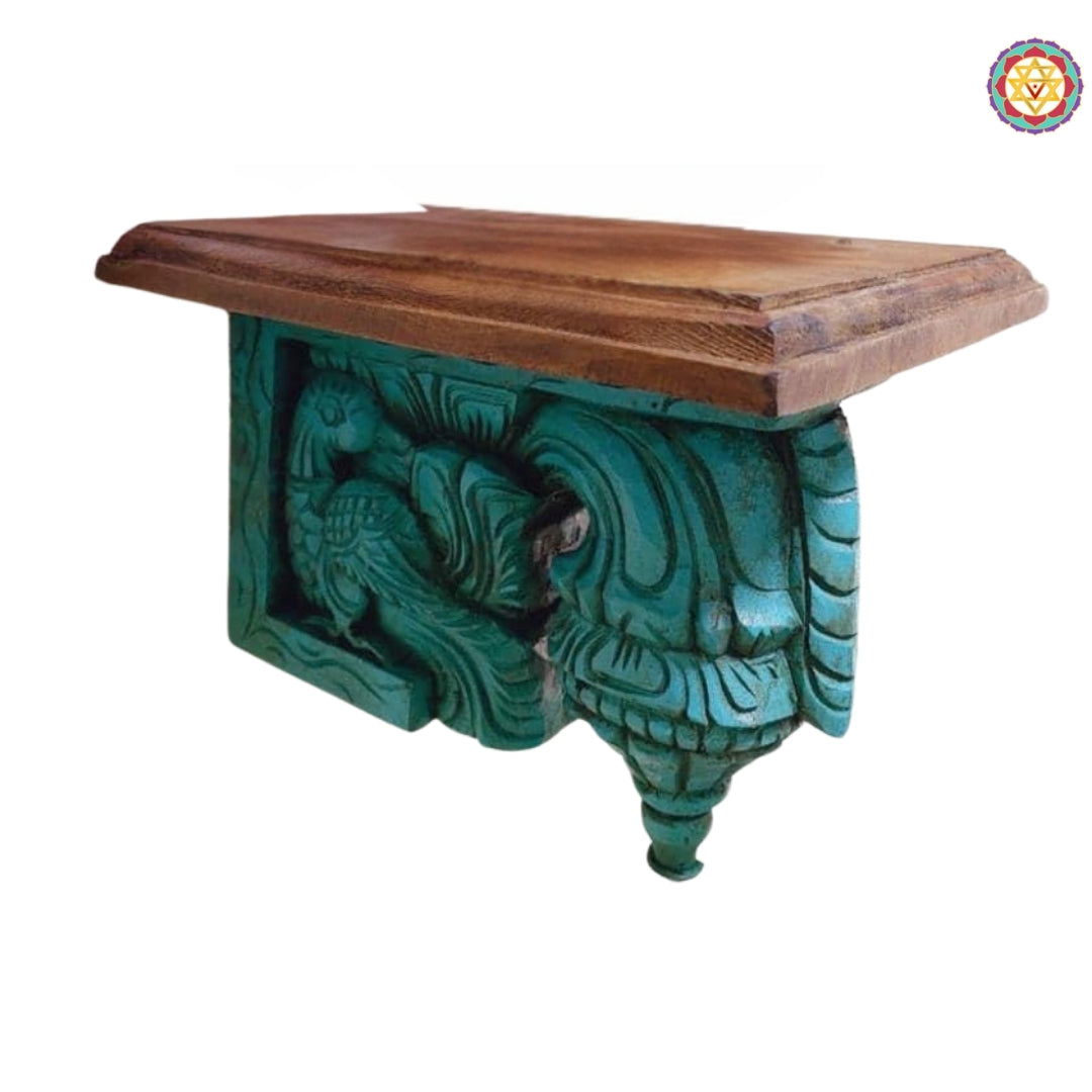 Close-up view of wooden bodhil bracket with peacock carving, highlighting delicate floral and annam designs