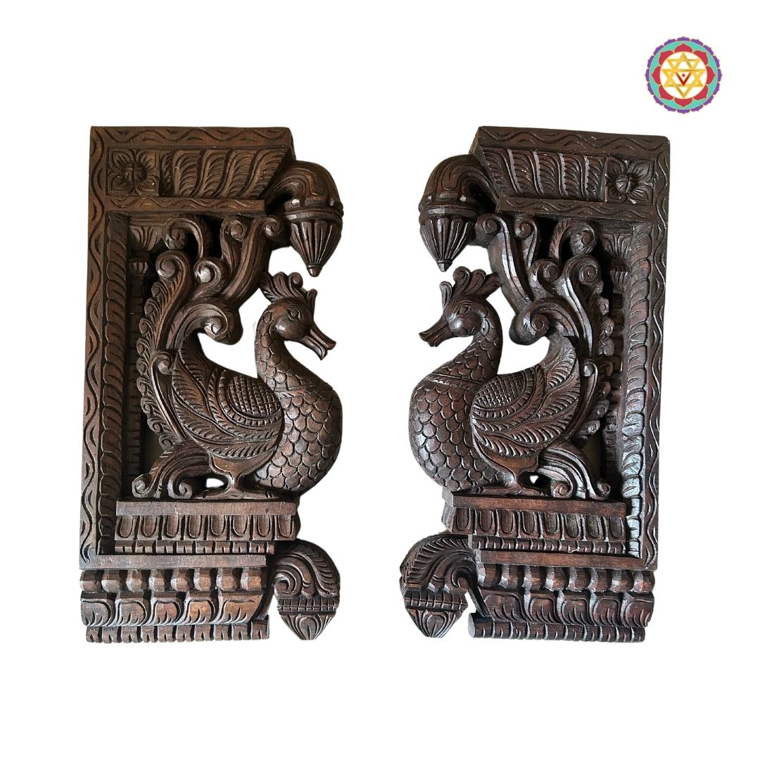 Close-up of hamsa bird carving on wooden wall bracket pair