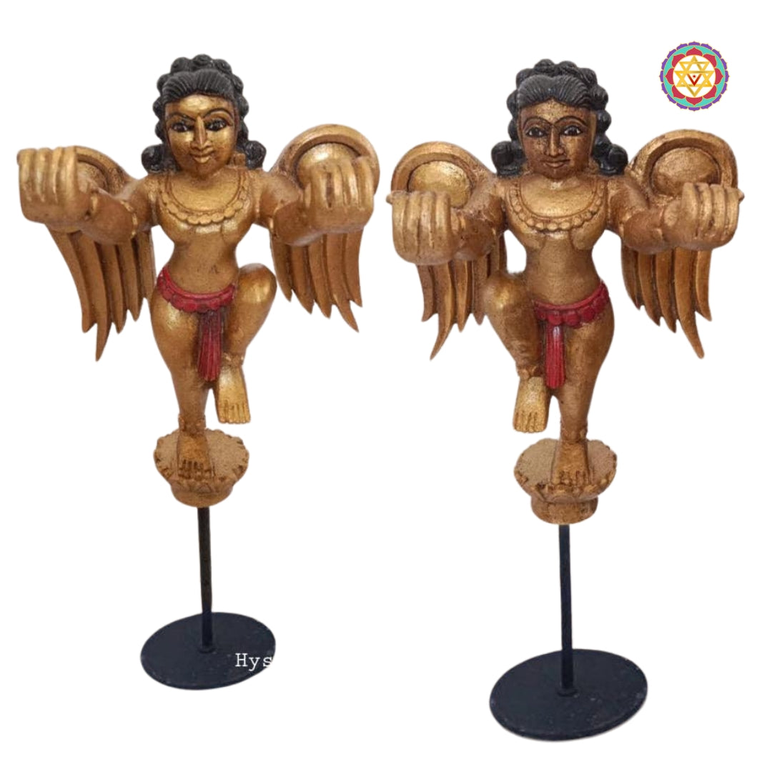 Front view of wooden Gandharva angel figure on rectangular base — intricate carving, antique polish finish