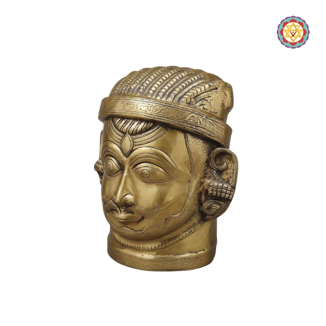close-up of Shiva forehead and crown carvings in golden polish