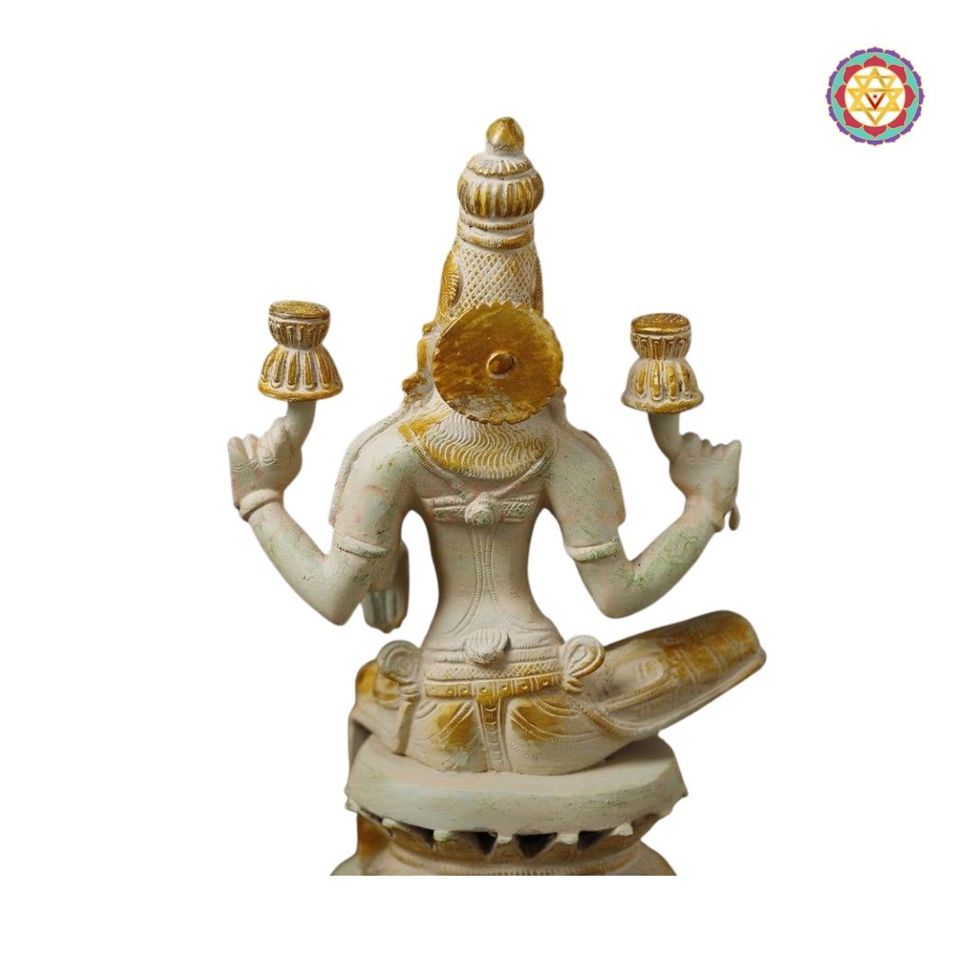 side view highlighting Lakshmi’s lotus seat and jewellery carvings