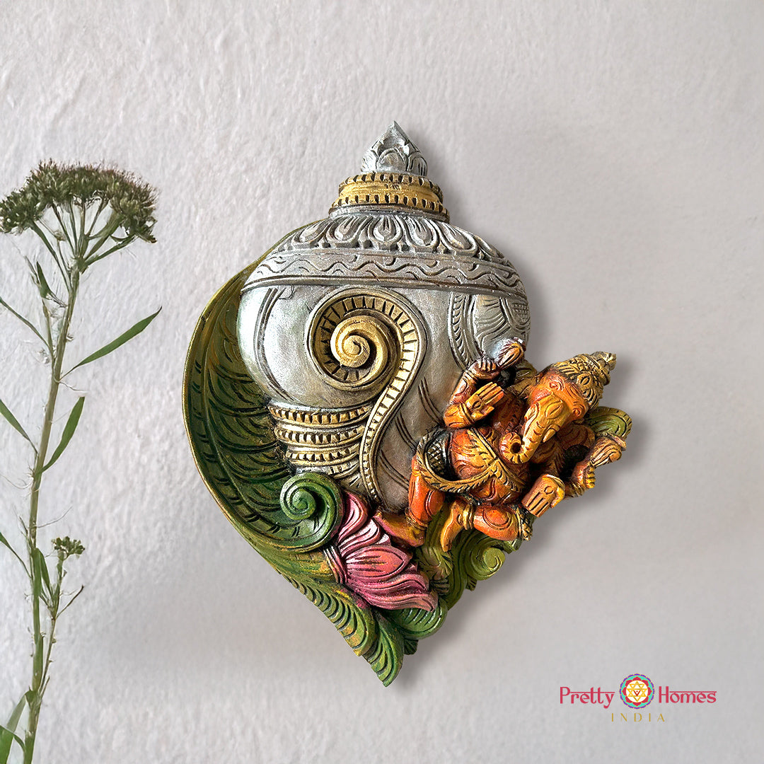 conch shankh ganesha on lotus carved wooden wall frame