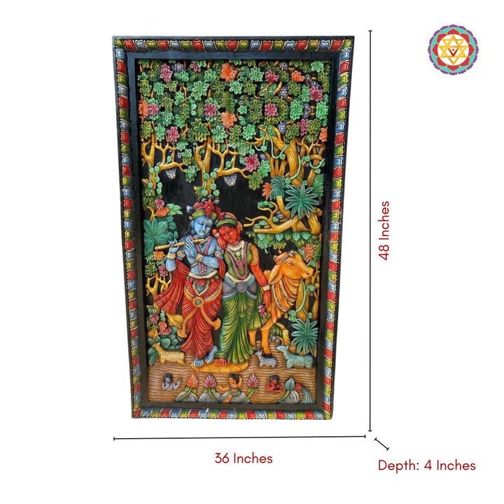 close-up of krishna and radha carved panel showing flute detail and textured craftsmanship