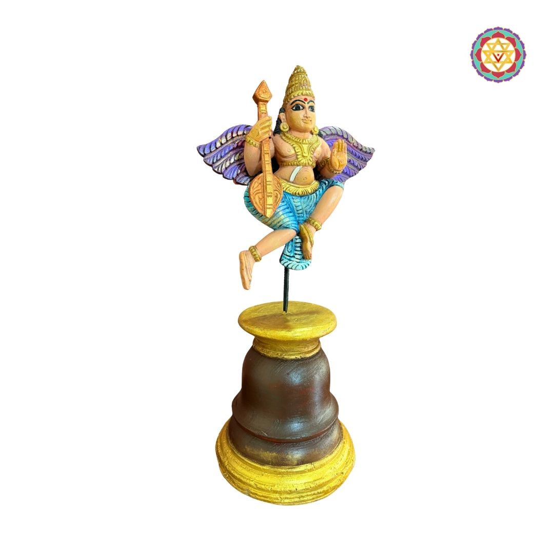 Beautifully handcarved Gandharva (Indian Angel) playing the Veena, crafted on a sturdy wooden stand.