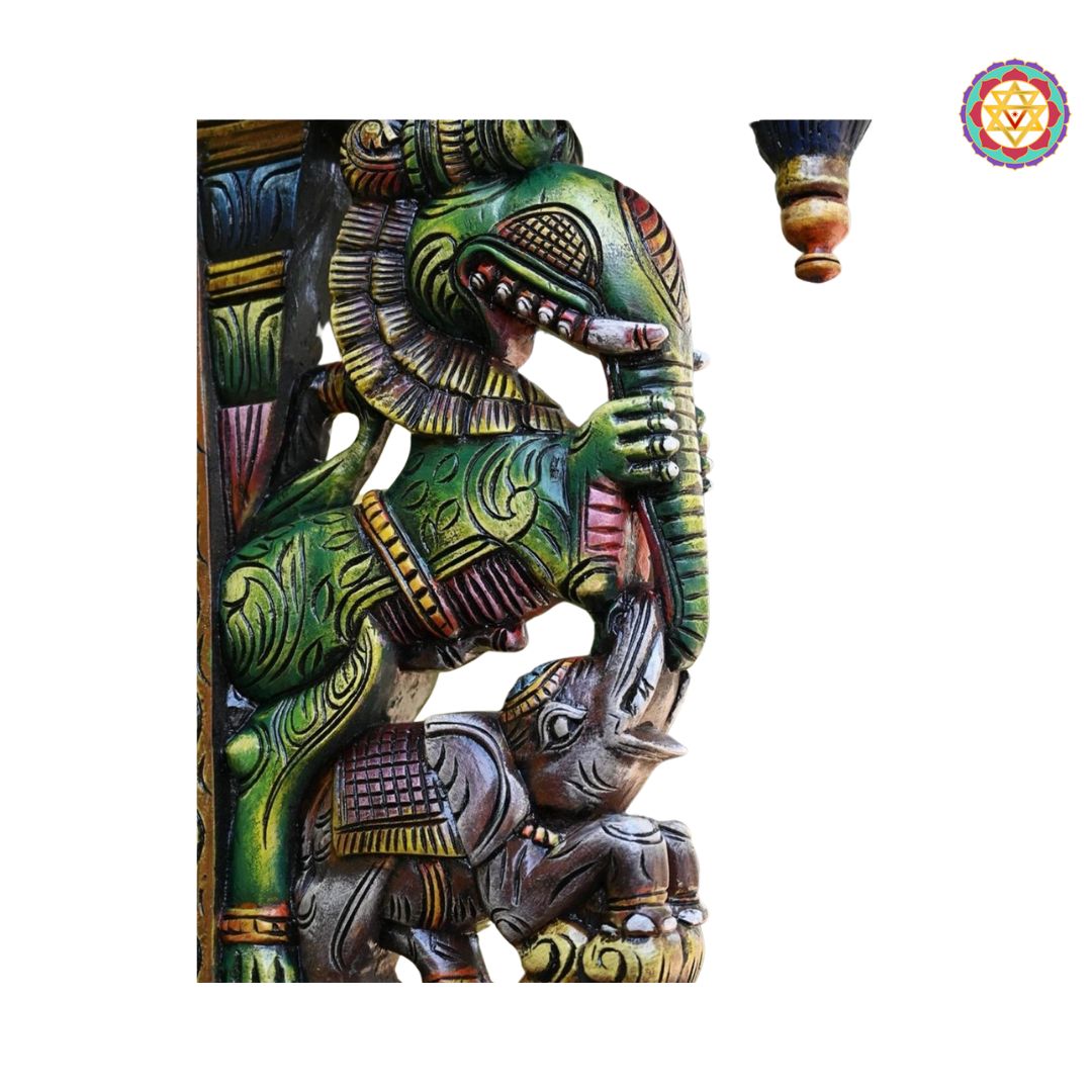 Side view of multicolour wooden corbel featuring elephant carving