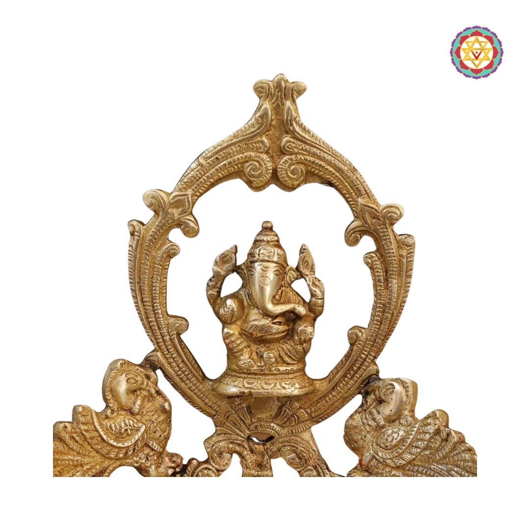 close-up of Ganesh urli centerpiece highlighting intricate brass detailing
