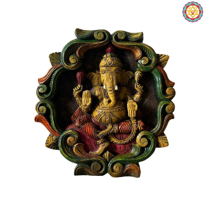 Colourful woodcarved ganesh wall frame with vines.