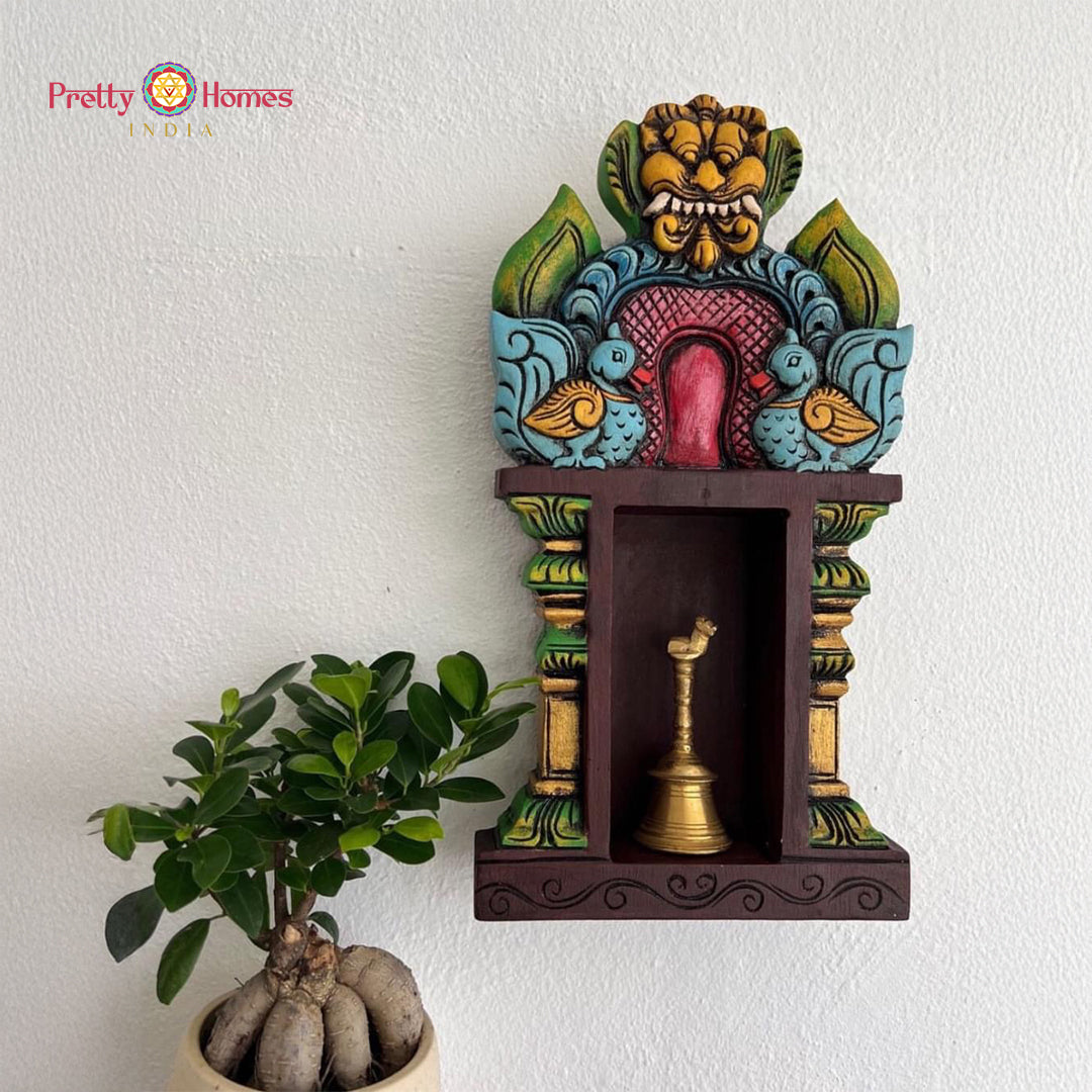 Wooden temple wall shelf — pillar design with traditional carvings.