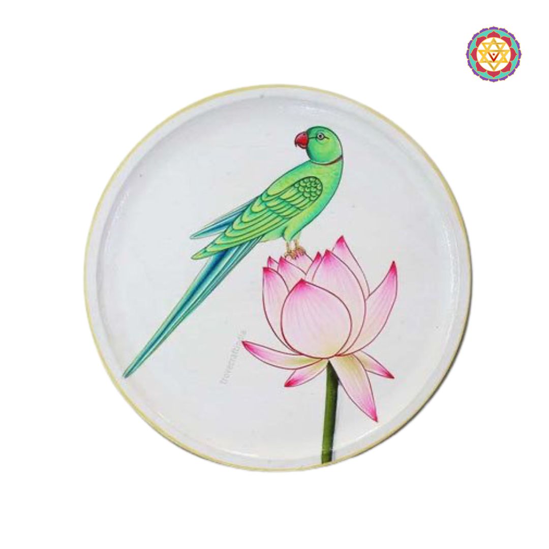 Minimal handpainted parrot wall plate resting on a pink lotus flower.