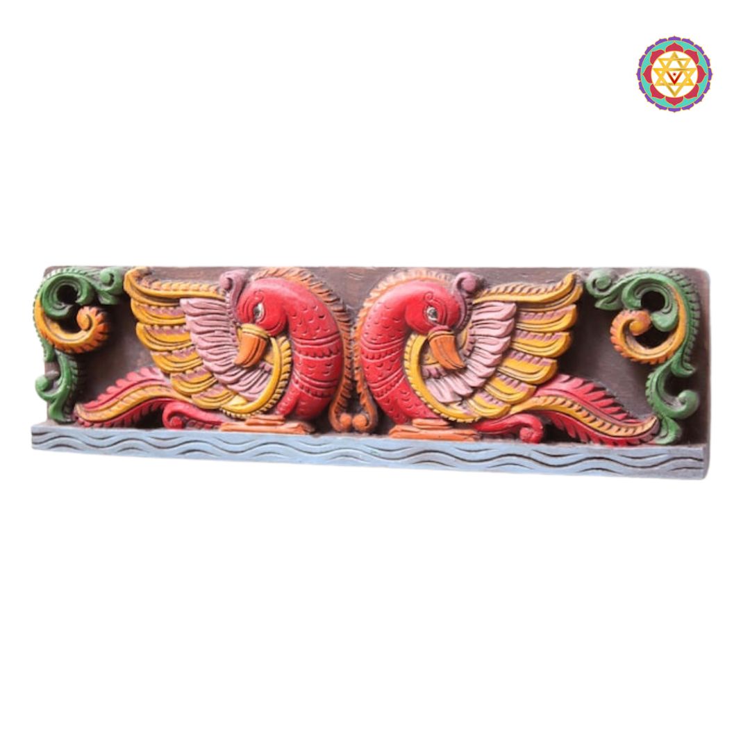 annams wooden panel detailed shot highlighting carved bird motifs