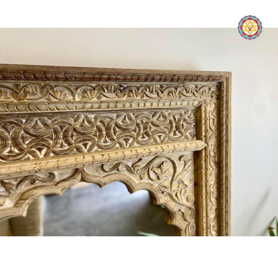“Distressed wooden Jharokha mirror highlighting floral and geometric motifs.”