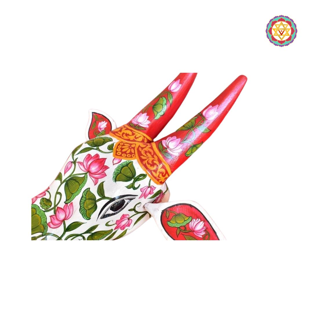 Side view of cow head wall decor in traditional floral design