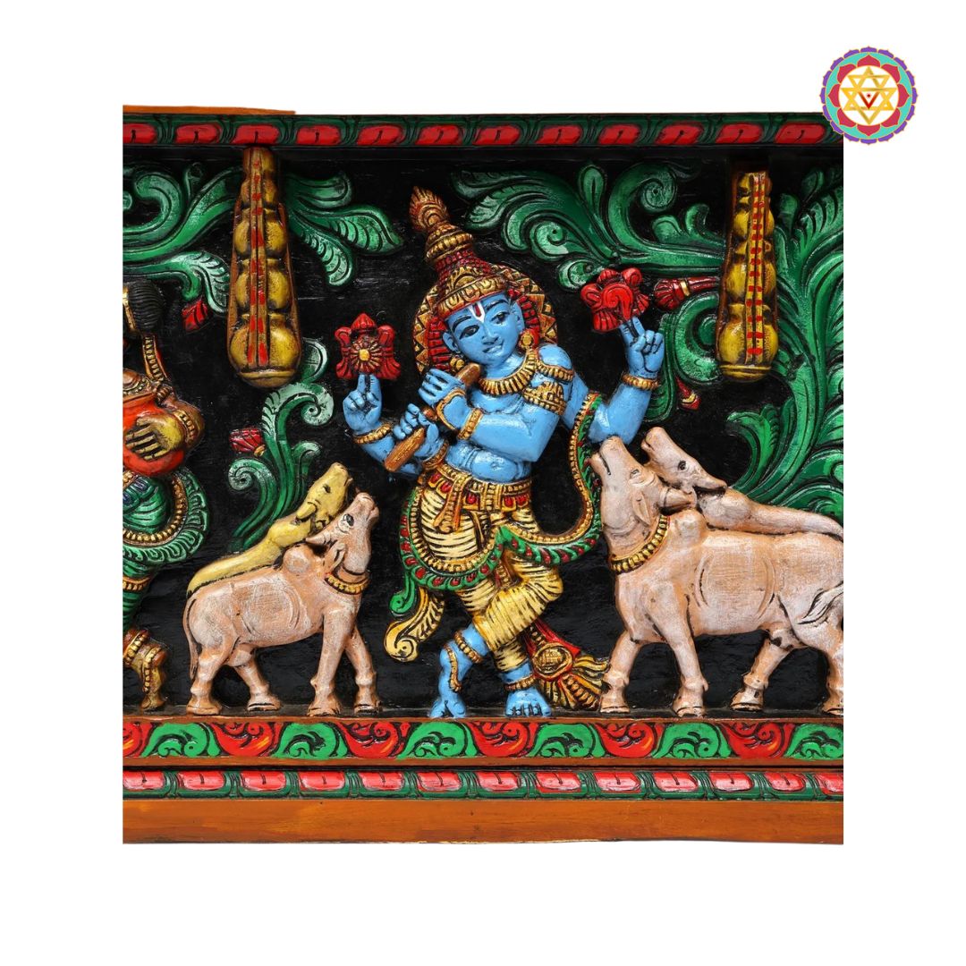 Decorative panel with a colorful depiction of a Krishna flanked by two cows, set against a green and red background.