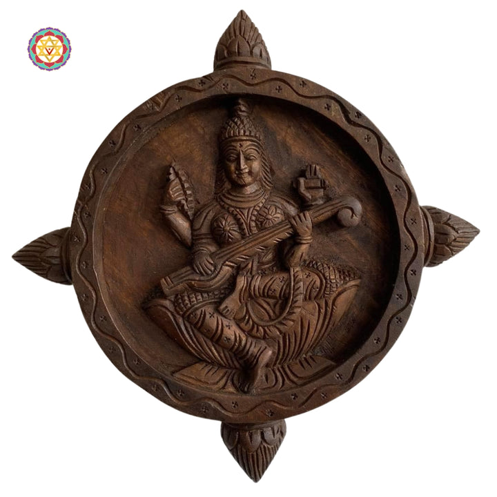 Wood carved round Goddess Saraswati