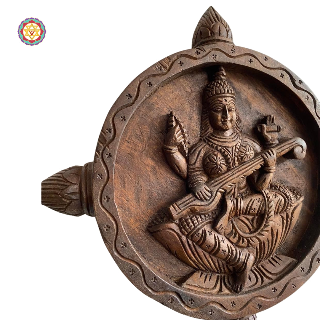 Artistic wooden Saraswati sculpture symbolizing wisdom and art