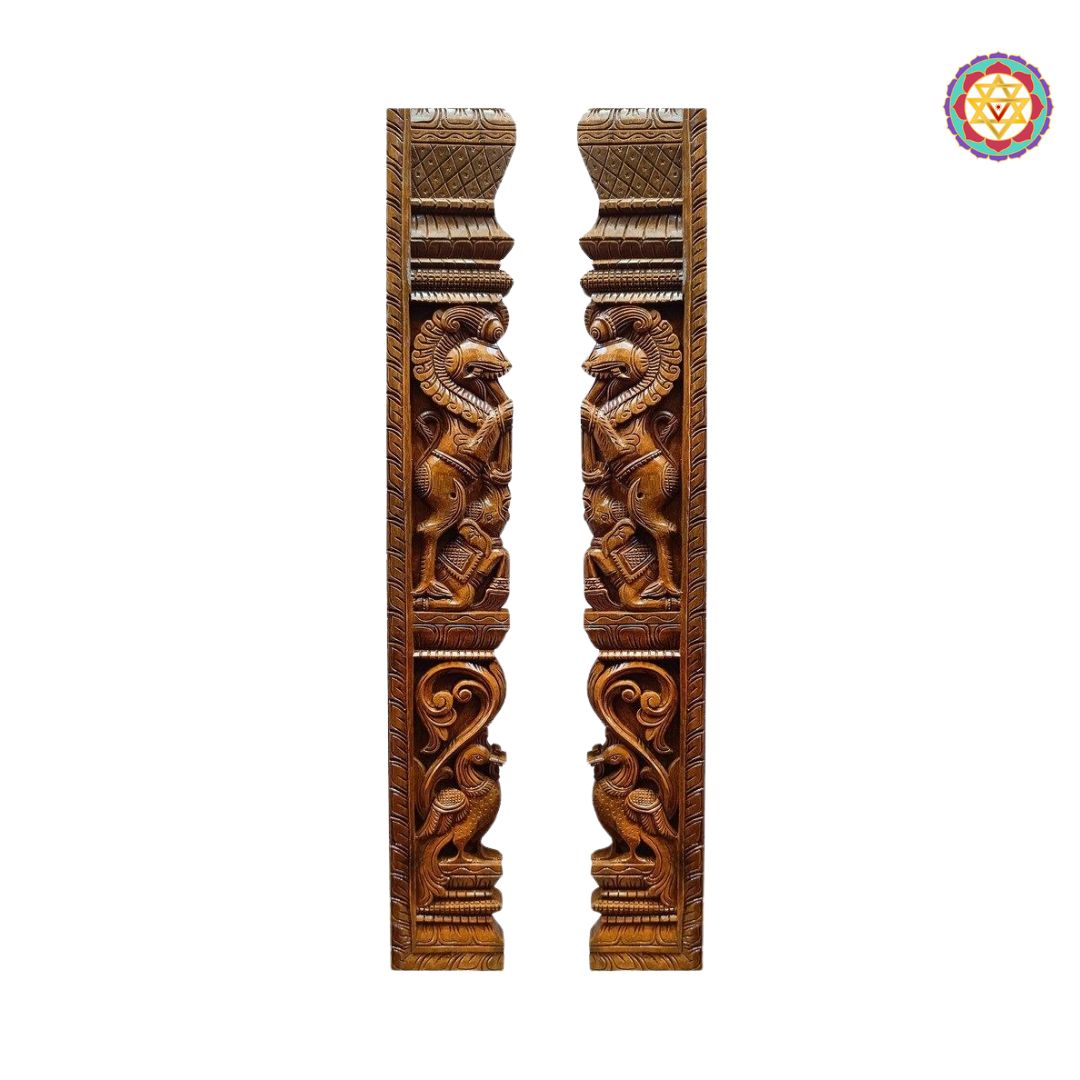 Pair of wooden carvings with intricate designs on a white background.Side-by-side view of carved Yali-peacock wooden panel pair.