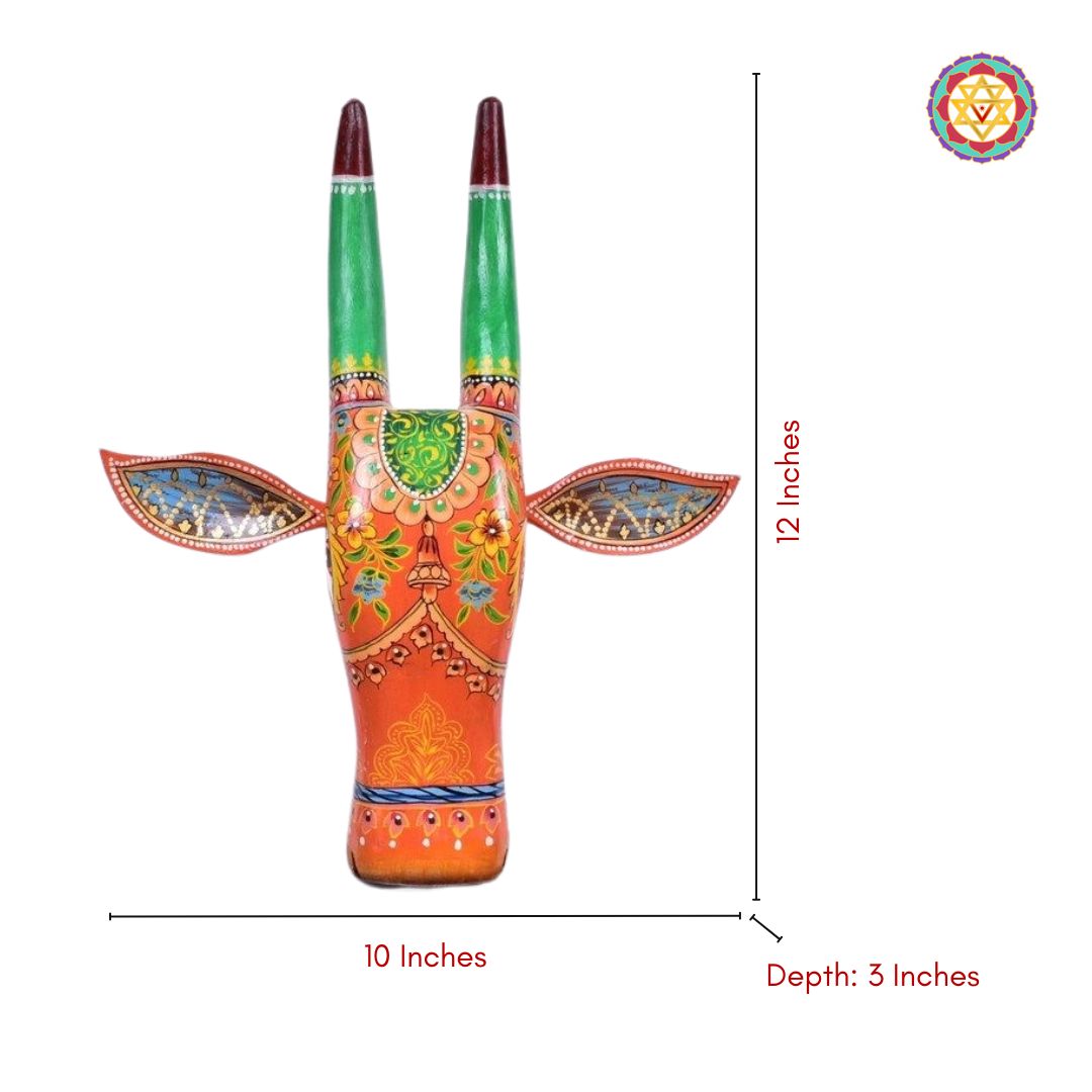 Decorative cow head wall decor featuring traditional Indian painting