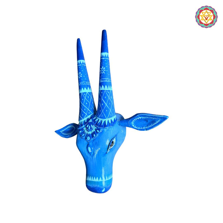Closeup detailing of aesthetic blue Nandi cow head carving