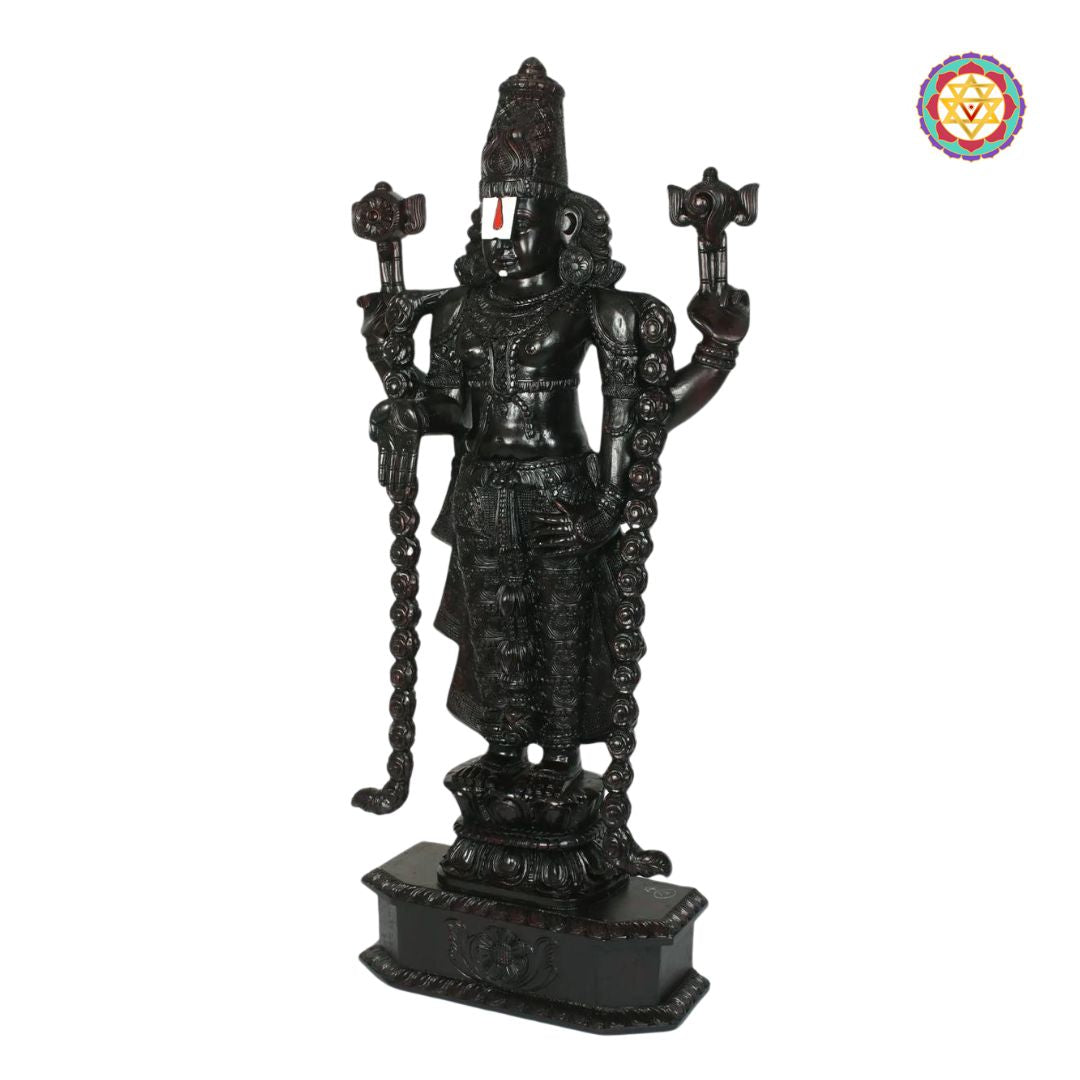 close up of tirupati balaji idol showing carved jewelry and crown