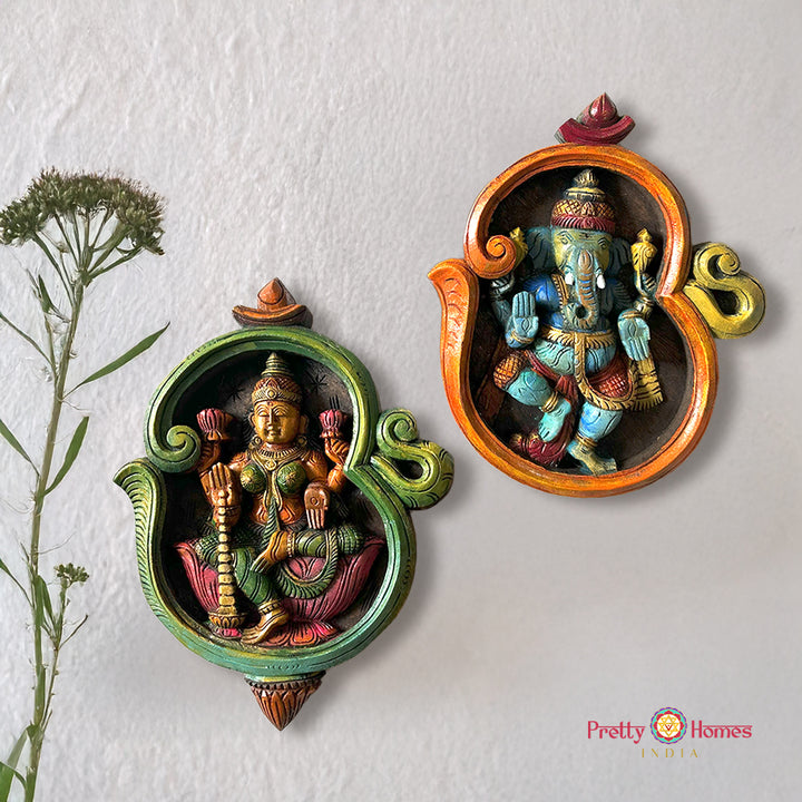 woodcarved exclusive om shaped Dhanlaxmi and blessing Ganesha wall frames-set of 2