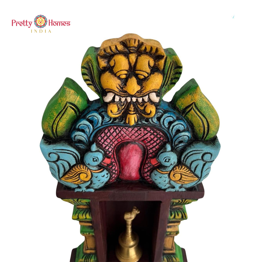Wooden pooja shelf with carvings — South Indian temple art.
