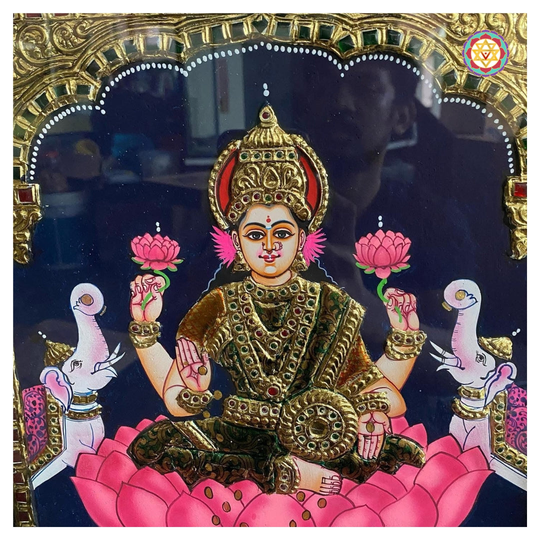 “Goddess Lakshmi seated on pink lotus with elephants pouring water, in traditional Tanjore painting style”