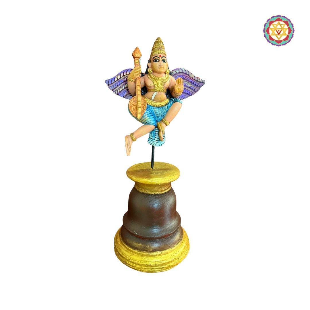 Beautifully handcarved Gandharva (Indian Angel) playing the Veena, crafted on a sturdy wooden stand.