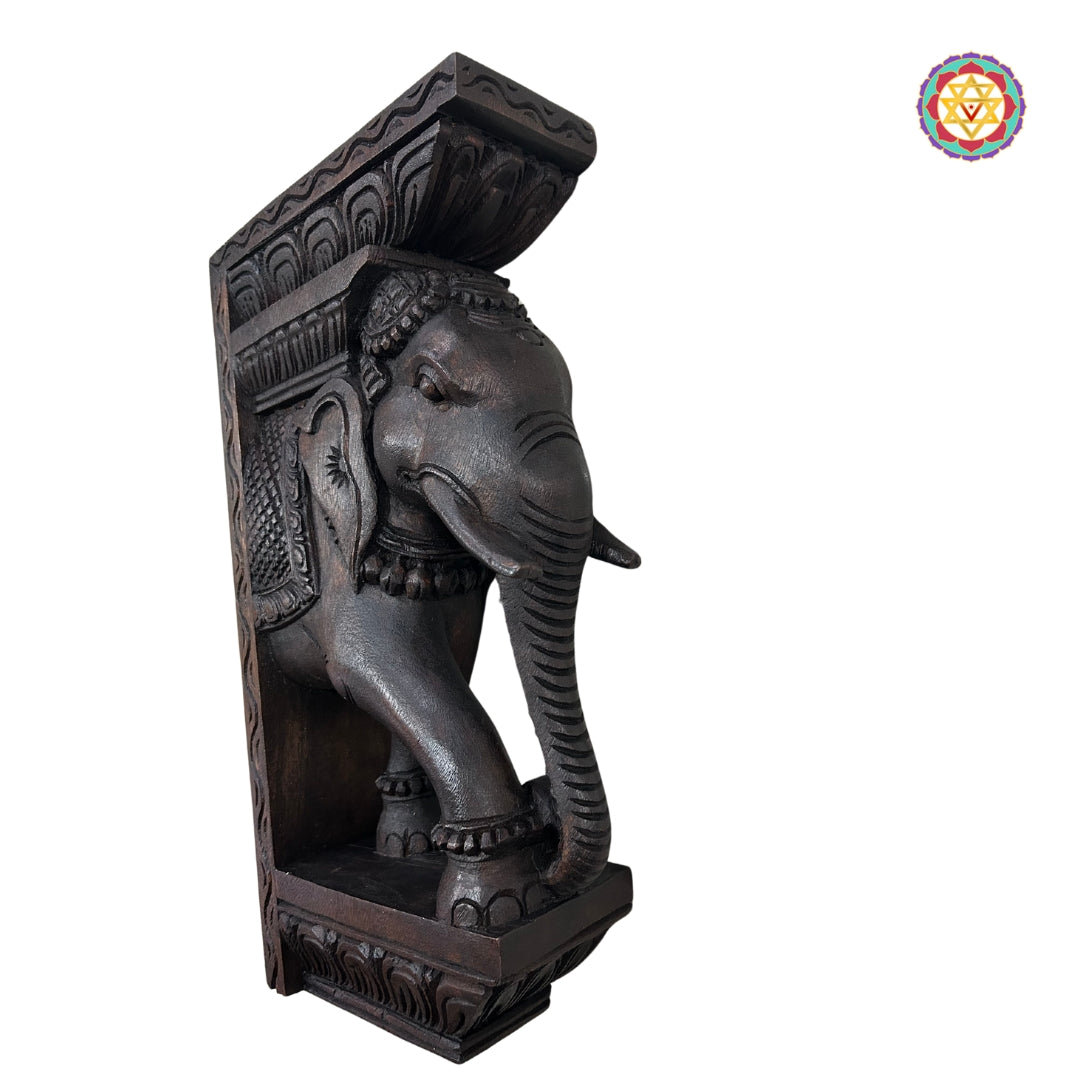 Close-up of Ganesh-themed elephant bracket with detailed carvings