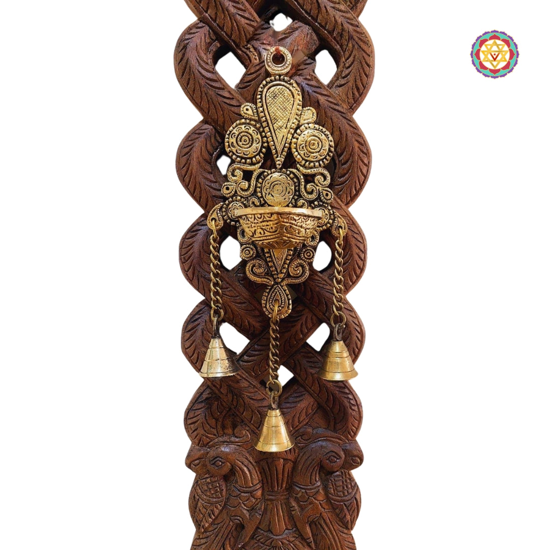 Hanging brass diya and bells detail