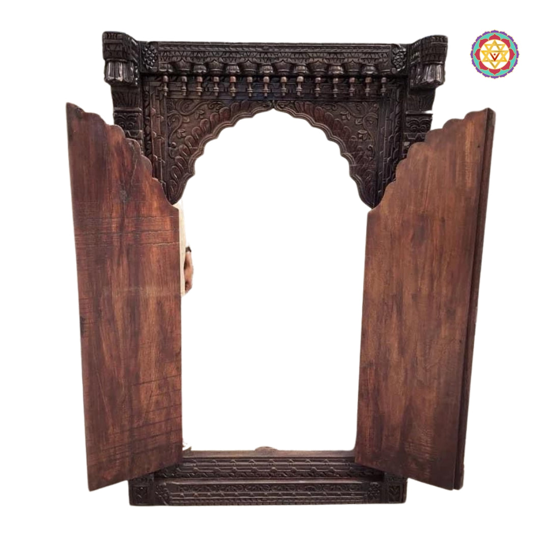 “Open wooden Jharokha window showing intricate carving details and rich natural finish.”