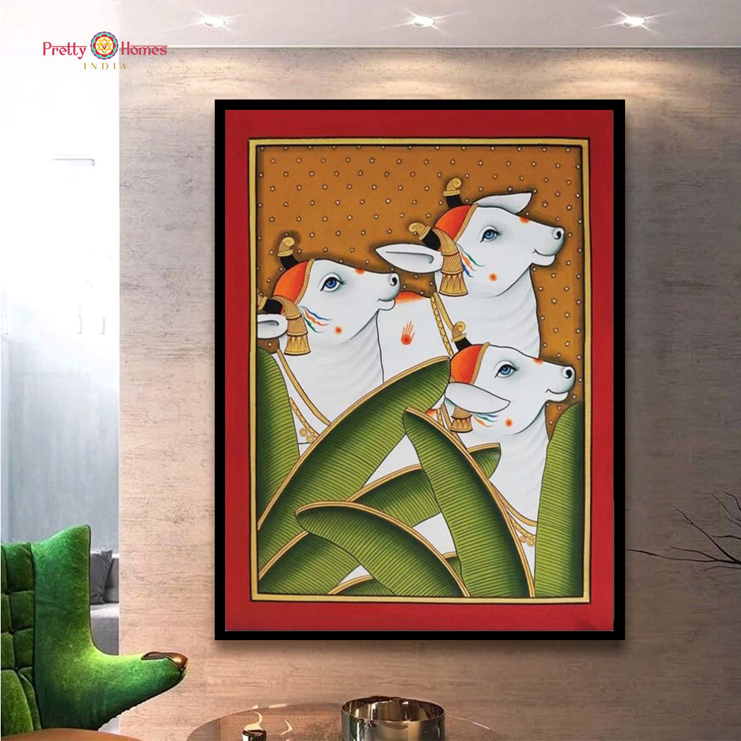 Closeup detailing of small Pichwai cows and leaves painting