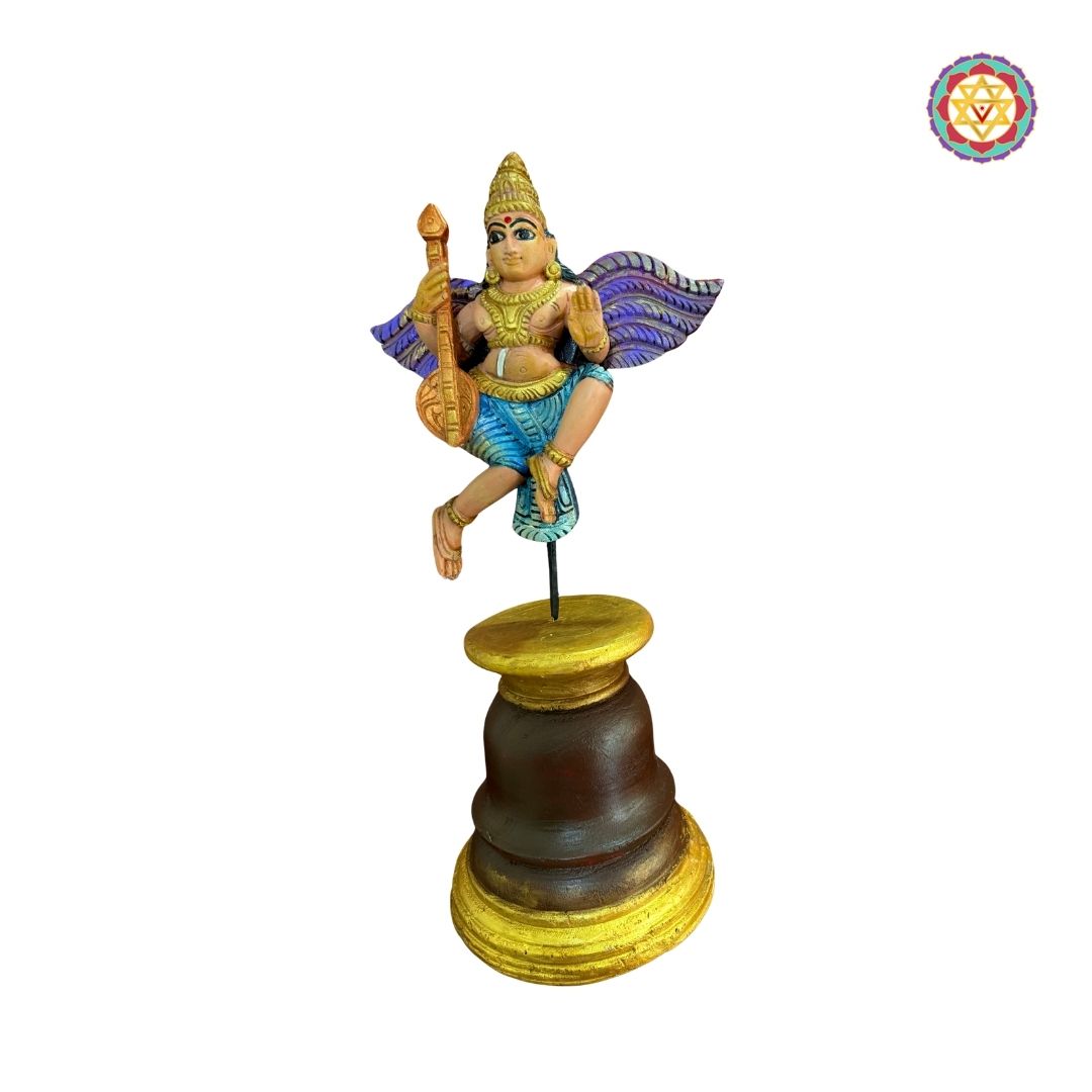 Beautifully handcarved Gandharva (Indian Angel) playing the Veena, crafted on a sturdy wooden stand.