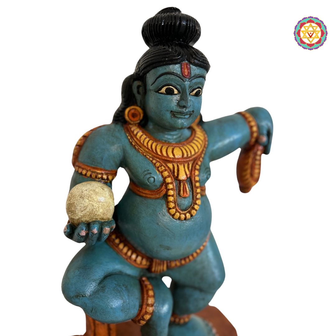 woodcarved bal krishna idol with detailed embellishments