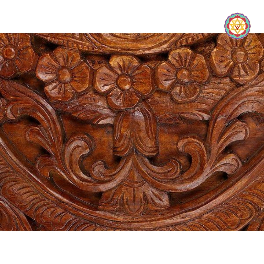 Close-up of intricate floral scrollwork in panel center